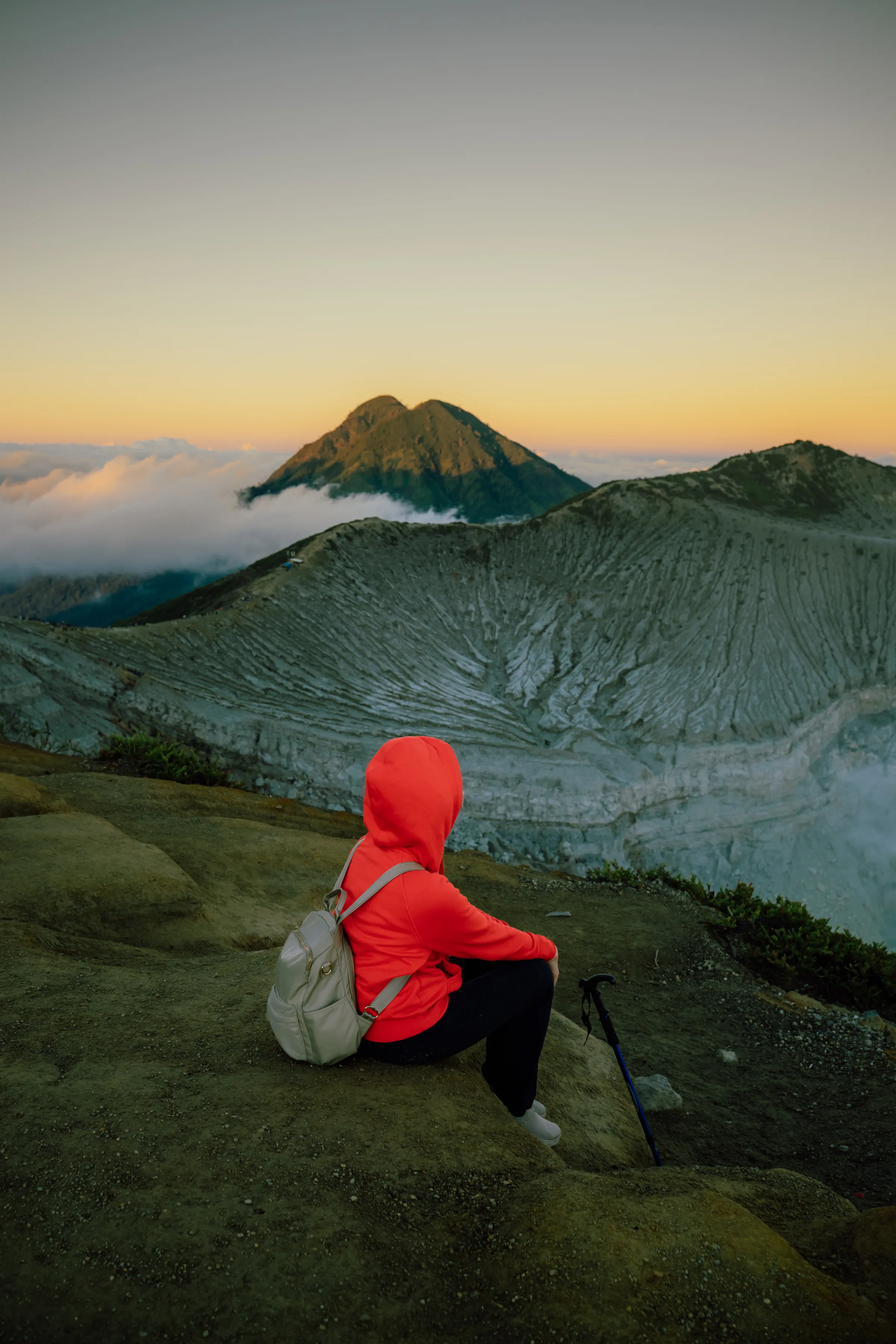 Golden-hour view across the Ijen caldera with distant peaks